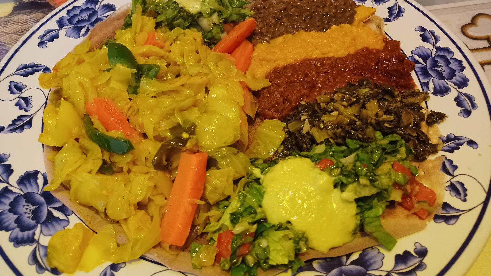 Ethiopian lentil, split pea and vegetable dishes served on injera at a restaurant in Oakland, California