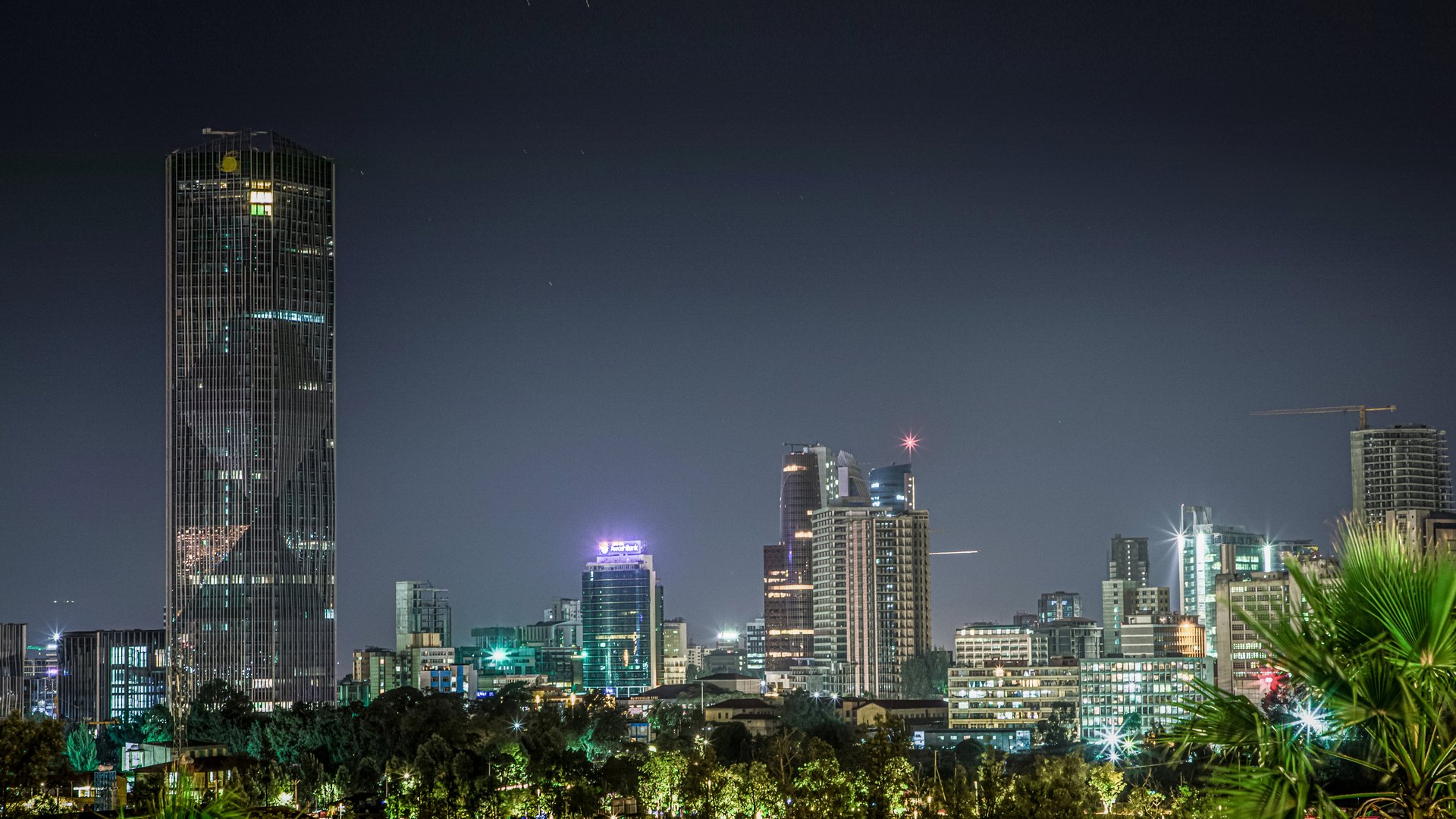 Addis Ababa skyline at night, with the tall Commercial Bank of Ethiopia headquarters tower on the left